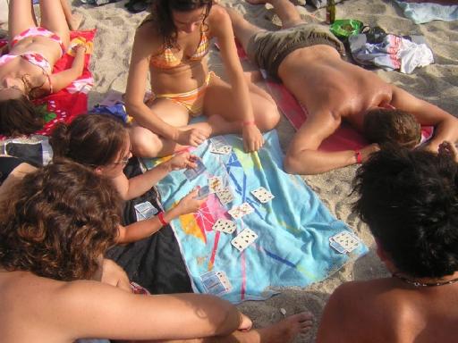 77: playing cards on the beach