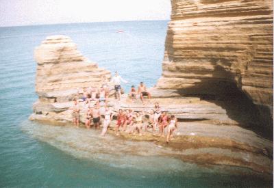 29: Beach, with a lot of rocks, where many people took a mask, which was according to the Greek people very healthy.