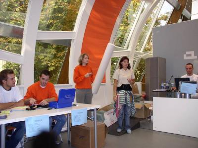 16: Alice in Registration Land! The Agora coordinator officially opened the registration desk! People, get your badges!