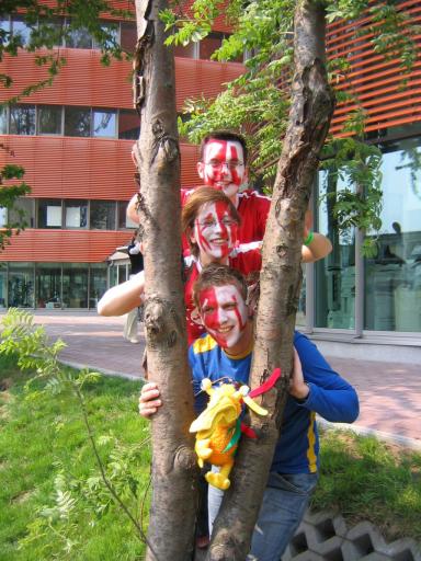 1: K-Town delegation hiding behind a tree.