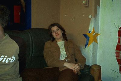 3: Olga sitting on the couch in Asterion