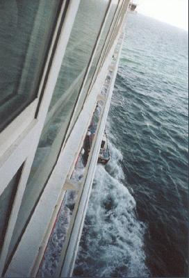 12: Small pilot boat next to the big cruise boat to Greece.